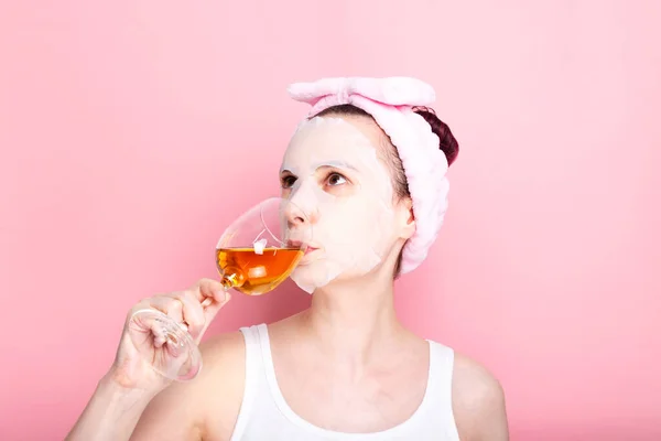 Woman Cosmetic Mask Her Face Holds Glass White Wine Pink — Stock Photo, Image