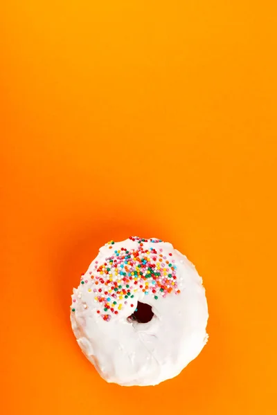 Donut White Icing Multicolored Sugar Pastry Topping Orange Background Flat — Stock Photo, Image