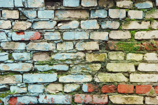 Wielokolorowe Teksturowane Cegły Stara Ściana Różnymi Warstwami Farby Mchu — Zdjęcie stockowe