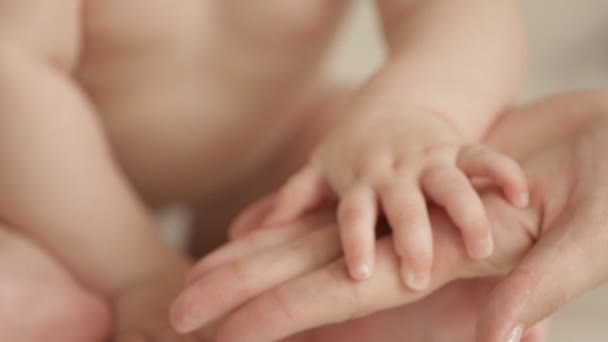Newborn baby holding his mothers finger - Stock Footage. 