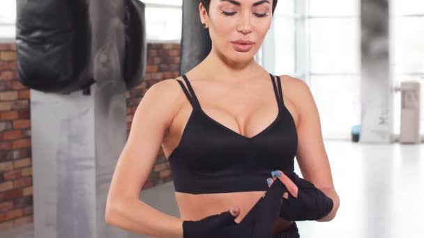 Beautiful Female With Short Black Hair Putting On Straps While