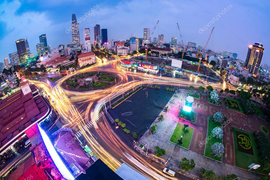 HO CHI MINH, VIETNAM - MARCH 11 2016: Impression, colorful, vibrant scene of traffic, dynamic, crowded city on street, Quach Thi Trang roundabout at Ben Thanh market.