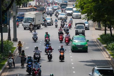 Ho Chi Minh, Vietnam - 11 Mart 2017: Motosiklet binlerce Ho Chi Minh City olarak da bilinen Saigon, Vietnam en büyük kenti sokaklarında kalabalık