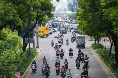 Ho Chi Minh, Vietnam - 11 Mart 2017: Motosiklet binlerce Ho Chi Minh City olarak da bilinen Saigon, Vietnam en büyük kenti sokaklarında kalabalık