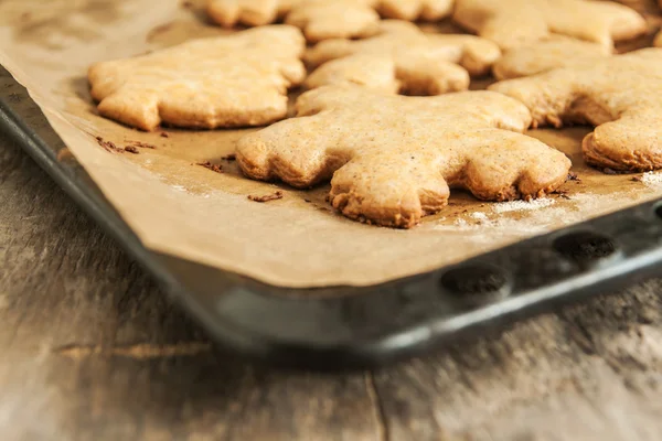 Christmas cookies on a baking sheet close up — Stock Photo, Image