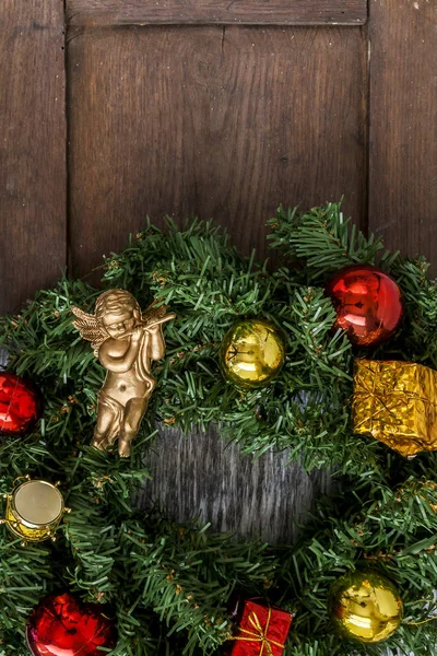 Christmas wreath on the door of a wooden house