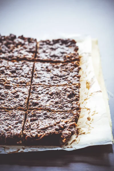 Chocolate fudge with nuts, each piece is packed separately — Stock Photo, Image