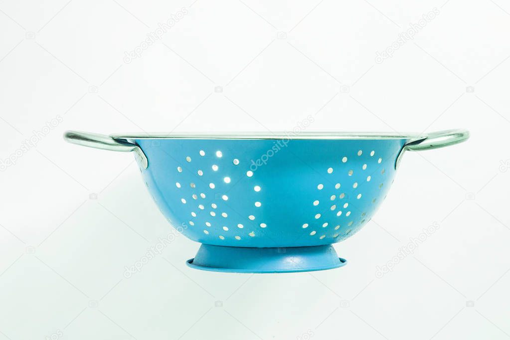 Old blue metal colander sieve isolated on white background