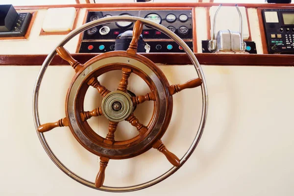 Captain\'s cabin and steering wheel, close-up on a yacht
