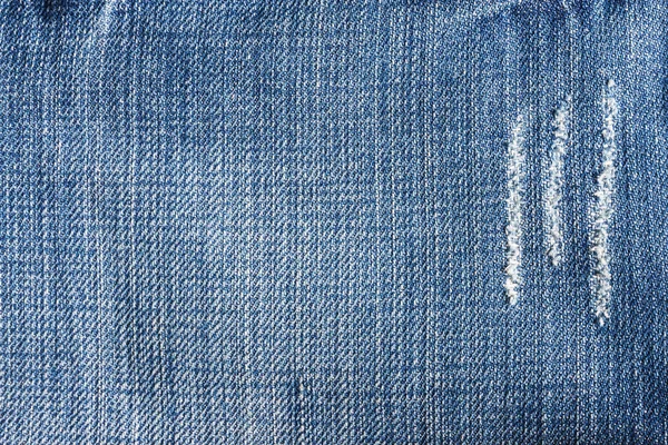 Jeans close-up, textura, rasgado, peças esfregadas . — Fotografia de Stock