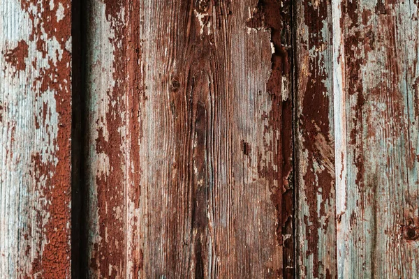 Colored wood background with peeling old paint — Stock Photo, Image