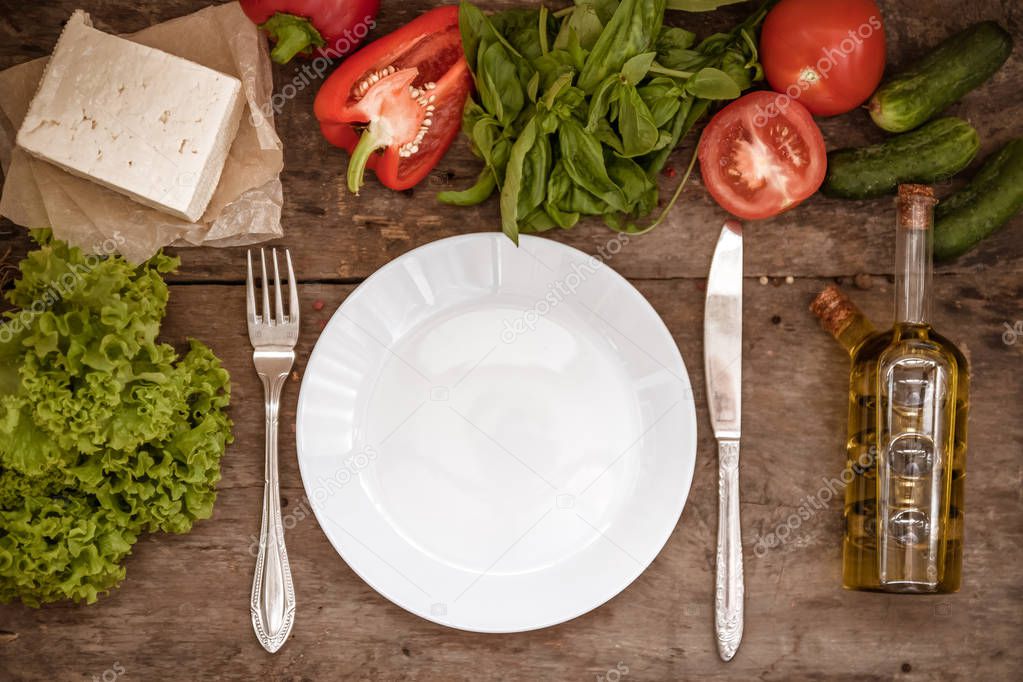 Raw ingredients of salad, tomato, cucumber, pepper, olive oil, f