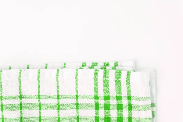 Groene doek, een keuken handdoek met een geruit patroon, op een whit — Stockfoto