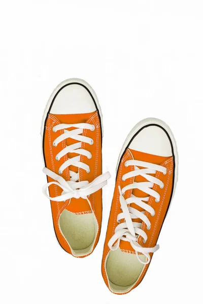 Par de zapatillas de deporte de color joven zapatillas de running en un fondo blanco — Foto de Stock