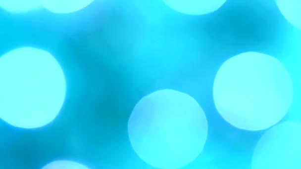 Lumières festives bleu-aquamarine clignotantes dans le flou bokeh. Fixé. Concept, Noël et célébration du Nouvel An .