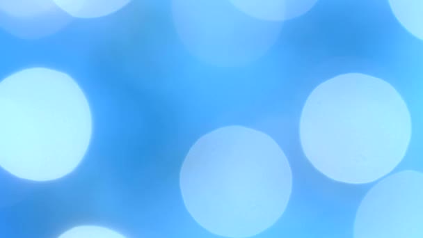 Lumières festives bleu-aquamarine clignotantes dans le flou bokeh. Fixé. Concept, Noël et célébration du Nouvel An .