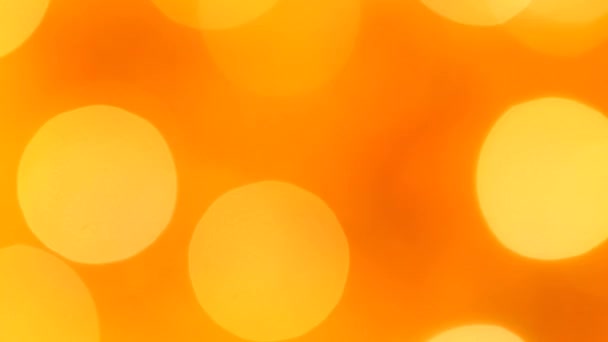 Feux clignotants rouge-orange dans le flou bokeh. Fixé. Concept, Noël et célébration du Nouvel An .