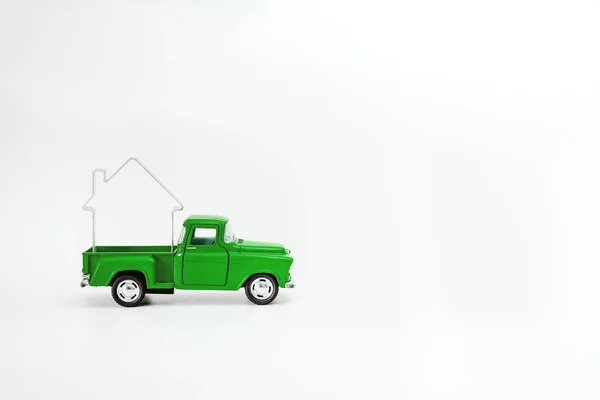 Miniature blue-green-aquamarine retro pickup car lucky house isolated on white background — Stock Photo, Image