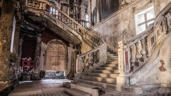 Destroyed church and staircase with cross — Stock Photo, Image