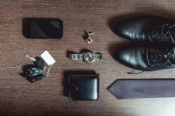 Accessories grooms wedding day. Wallet watch cufflinks tie shoes mobile phone car keys
