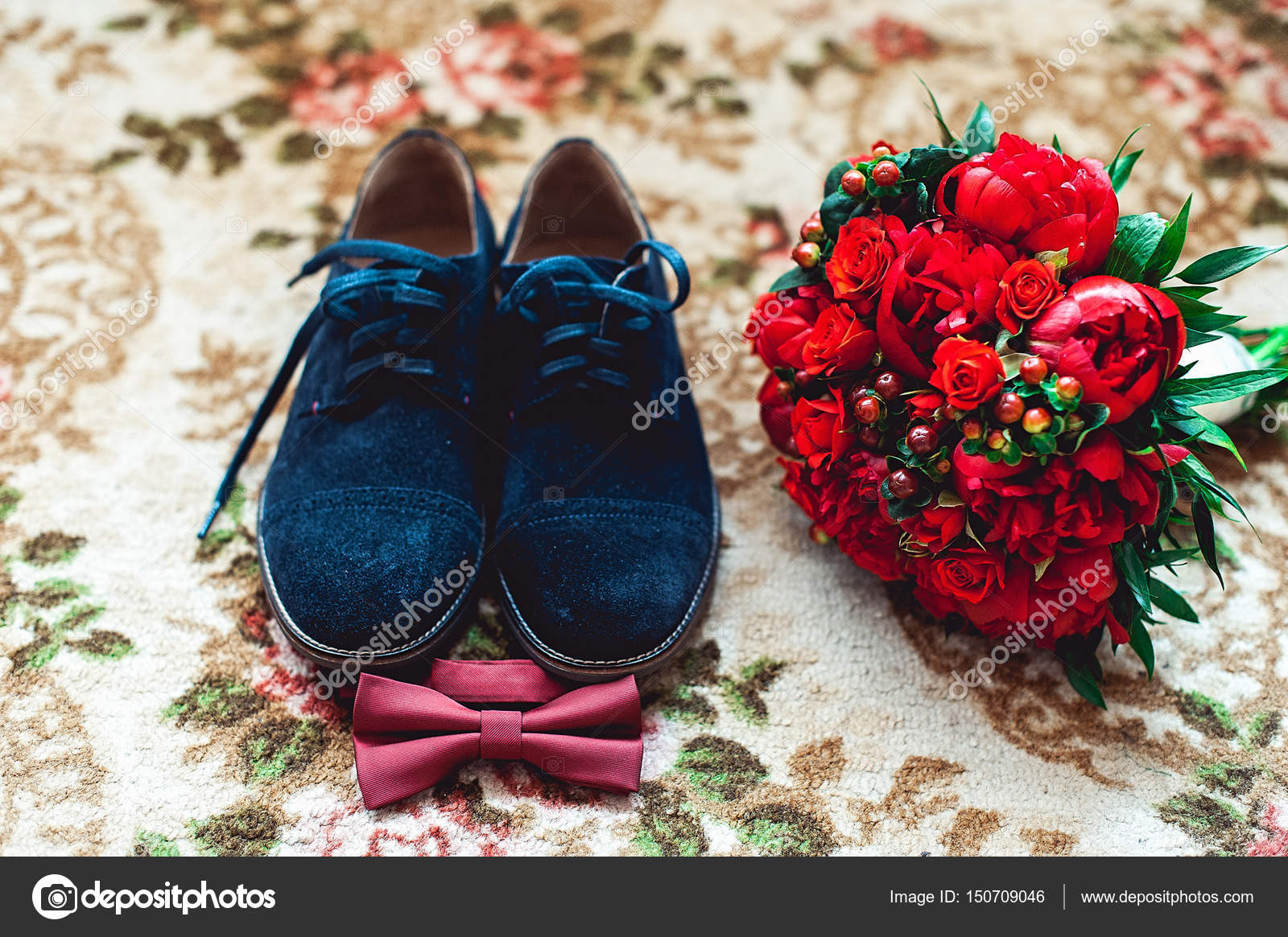 Close up of modern man accessories. Cherry bow tie, blue leather shoest and  red wedding bouquet on a carpet. Stock Photo by ©Ashtray25 150709046