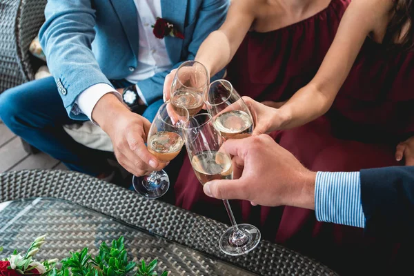 People hold in hands glasses with white wine. wedding party.