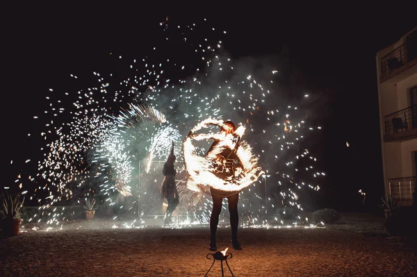 Fire dancing shows at night. Amazing fire show as part of wedding ceremony