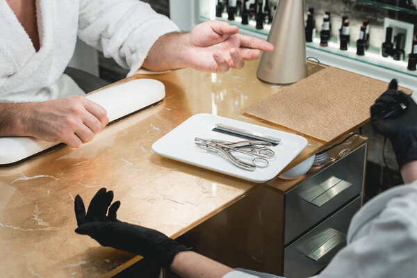 manicure instruments set on white plate