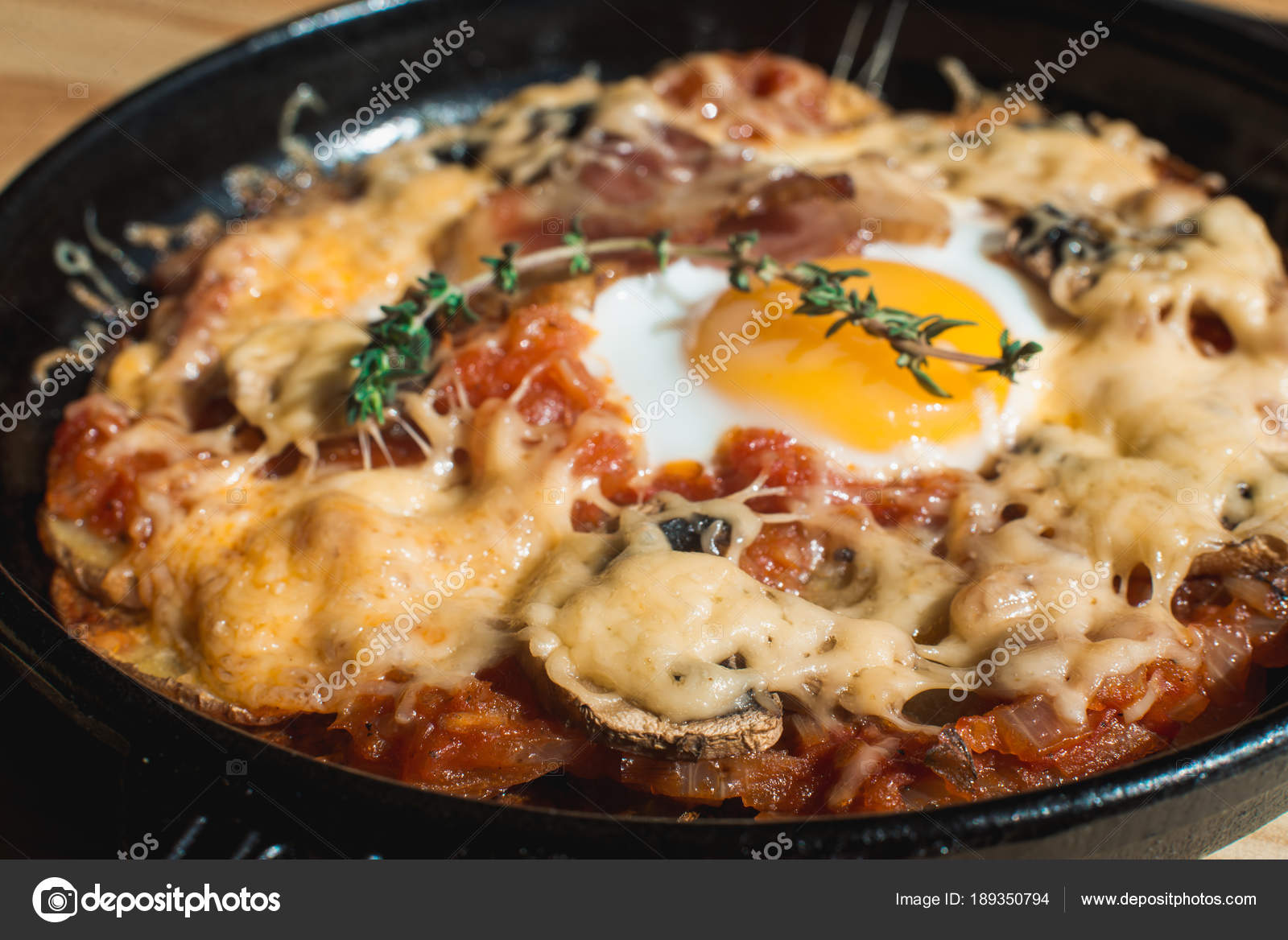 Tortilla con potatos. Typical spanish dish with bacon cheese tomato