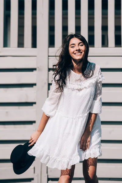 Lifestyle portrait of young stylish hipster woman, wearing trendy white dress — 스톡 사진