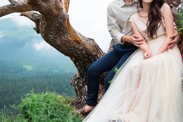 Happy young couple in love outdoors. Beautiful mountains view. L