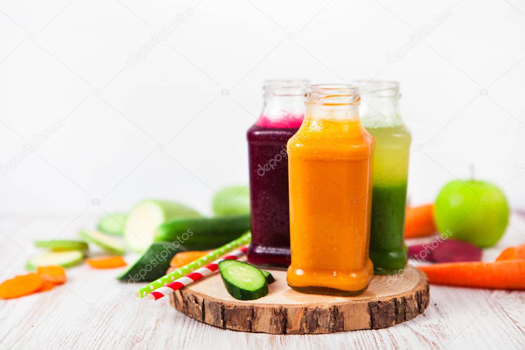 Freshly squeezed vegetable juice in bottles, useful vitamin cock
