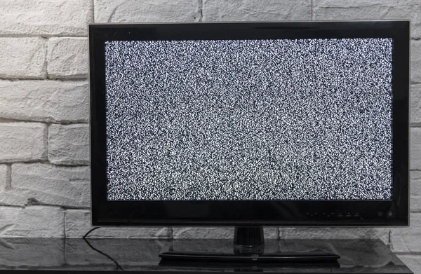 Tv screen with noise glitcher effect. No signal or no communication concept with rustic or loft style innterior. — Stock Photo, Image