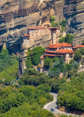 Mountain scenery with Meteora rocks and Roussanou Monastery, landscape place of monasteries on the rock. clipart