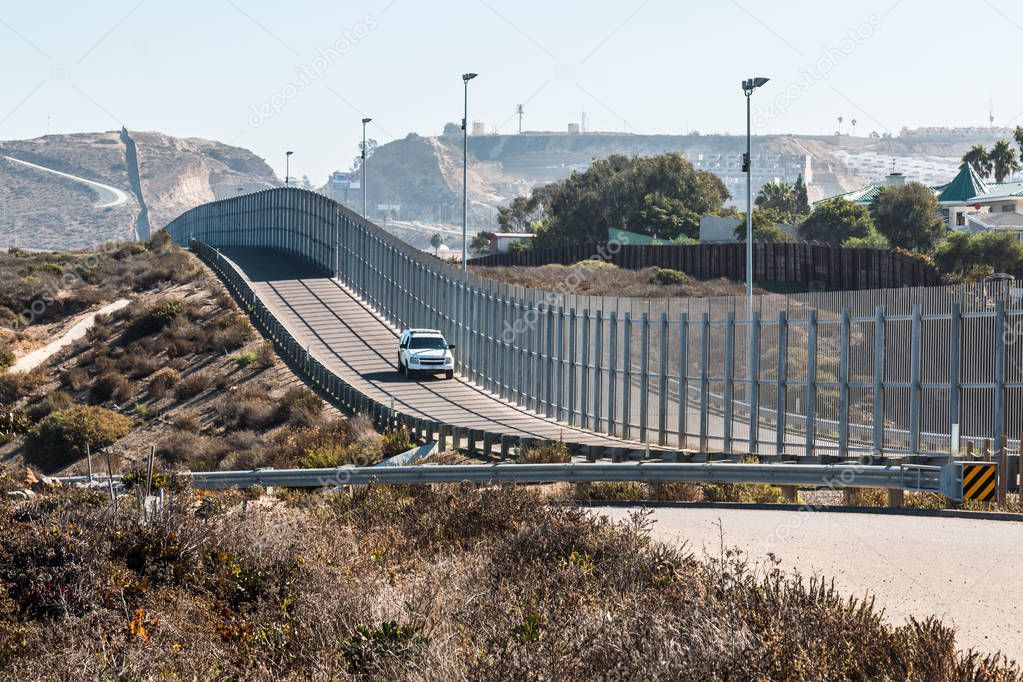 San DiegoTijuana International Border Wall and Border Patrol Vehicle