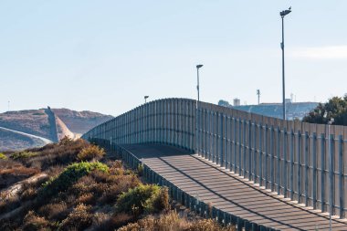 Section of International Border Wall Between San Diego/Tijuana clipart
