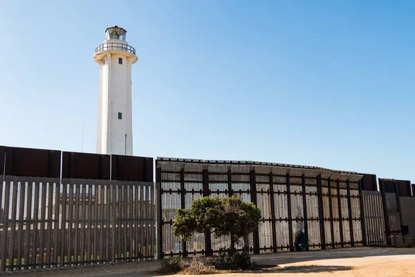 SAN DIEGO, CALIFORNIA - NOVEMBER 4, 2017:  People communicate through the international border wall between San Diego and Tijuana at Friendship Park, located near the El Faro Lighthouse.