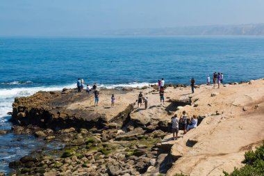 LA JOLLA, CALIFORNIA - JUNE 16, 2017:  People enjoy ocean views from the Boomer Beach area of La Jolla Cove. 