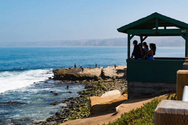 LA JOLLA, CALIFORNIA - JUNE 16, 2017:  People take in views of the ocean in the Boomer Beach area of La Jolla Cove.