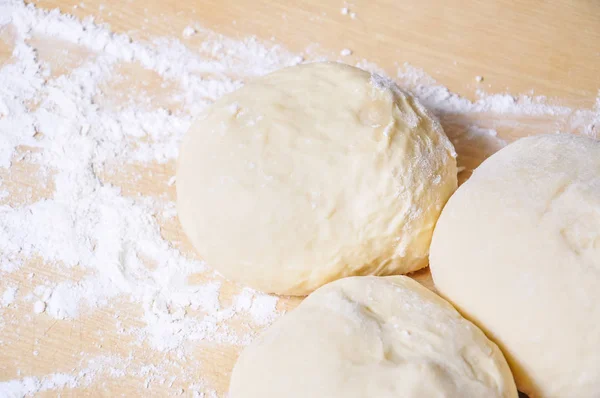 Raw wheat yeast dough on the table — Stock Photo, Image