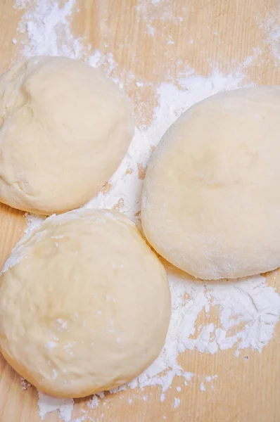 Raw wheat yeast dough on the table — Stock Photo, Image