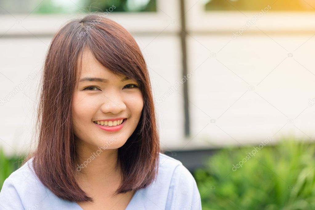 Portrait of a pretty happy woman, smiling