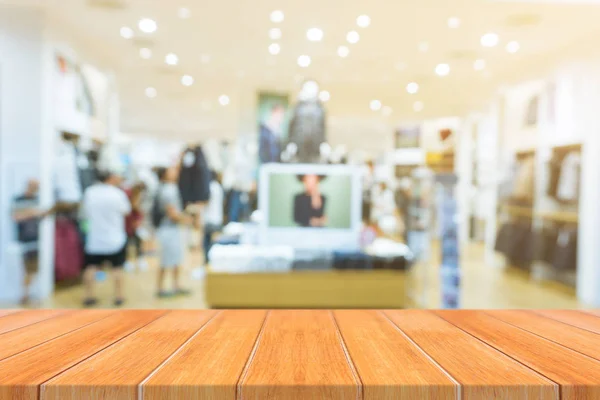 Wooden board empty table blurred background. Perspective brown wood over blur in department store - can be used for display or montage your products.Mock up for display of product. — Stock Photo, Image