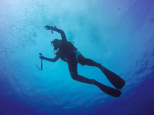 Underwater scuba diving selfie shot with selfie stick. Deep blue sea. Wide angle shot. — Stock Photo, Image