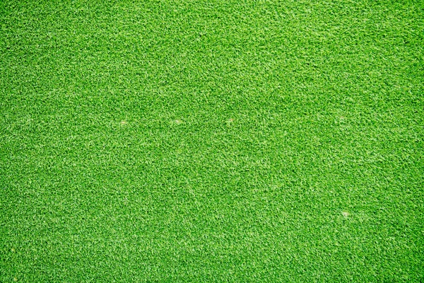 Natural grass texture patterned background in golf course turf from top view: Abstract background of authentic grassy lawn environmental textured pattern backdrop in bright yellow green color tone — Stock Photo, Image