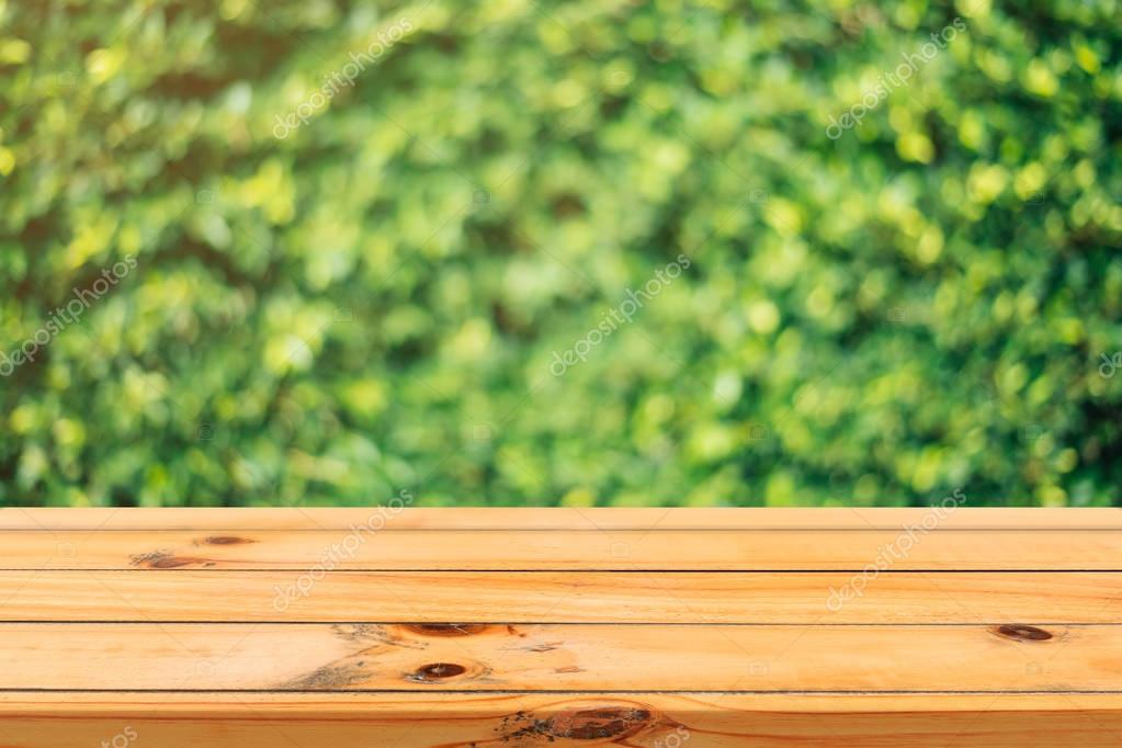 Wooden board empty table in front of blurred background. Perspective