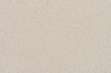 Geri dönüşüm kartonu veya kahverengi tahta kağıt doku arka planını kapat. Kahverengi kağıt yaprak desen arkaplanı.