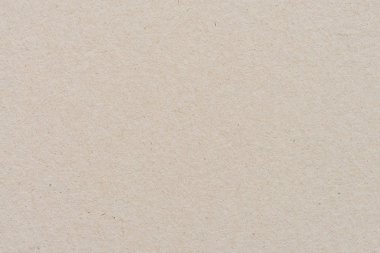 Geri dönüşüm kartonu veya kahverengi tahta kağıt doku arka planını kapat. Kahverengi kağıt yaprak desen arkaplanı.