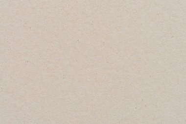 Geri dönüşüm kartonu veya kahverengi tahta kağıt doku arka planını kapat. Kahverengi kağıt yaprak desen arkaplanı.