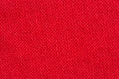 Kırmızı kumaş tuval makro doku ya da arka plan olarak vurdu